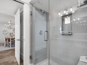 Bathroom 1 Step into your private glassenclosed shower with elegant gray tiles and modern fixtures, perfectly lit for your daily refresh.