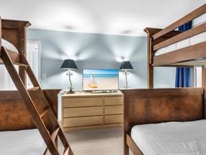 Bedroom 2  Your coastalthemed bedroom features sturdy bunk beds with crisp linens, tropical decor, and entertainment perfect for family adventures.