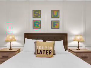 Bedroom 2  Beautiful accent wall with beachthemed artwork and playful pillows