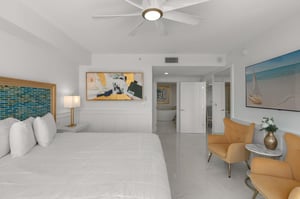 Your bright, beachy suite features a plush king bed and sunny seating area where you can unwind after ocean adventures.