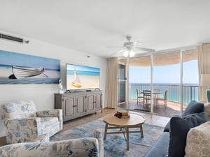 Relax in your bright coastal living space with stunning ocean views from your private balcony and comfortable seating for unwinding.