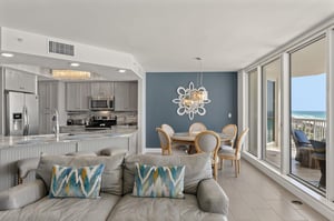 Your spacious living space flows seamlessly from kitchen to oceanview balcony, creating the perfect beach retreat for relaxing.