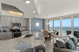 Your oceanfront escape features a stunning openconcept space where you are able to cook meals while soaking in breathtaking beach views.