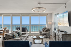 Unwind in your elegant living room where panoramic ocean views stretch endlessly beyond floortoceiling windows, creating your perfect coastal retreat.