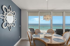 Gather around your elegant dining table with stunning ocean views streaming through floortoceiling windows.