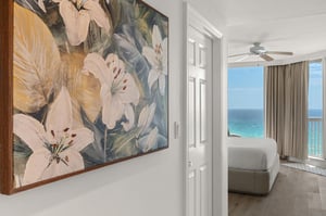 Youll be greeted by stunning floral artwork as you enter your oceanfront bedroom, where turquoise waters stretch endlessly beyond your private balcony.