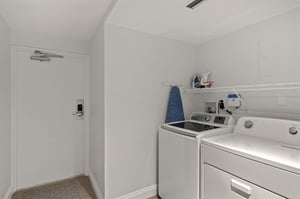 Your dedicated laundry room makes extended stays effortless with a fullsize washer, dryer, and convenient ironing station.