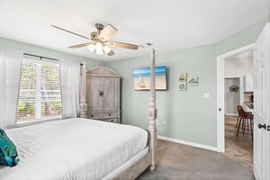 Drift off peacefully in your coastalthemed bedroom, complete with ceiling fan, spacious wardrobe, and charming nautical touches.