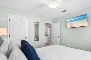 Bedroom 2 with queen bed and TV