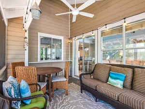 Relax on your private screened porch with comfortable seating, dining space, and ceiling fan for those perfect Florida evenings.