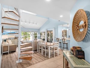 Relax in this bright, airy space where coastal blues meet warm wood tones.