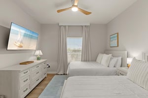 Sleep peacefully in your coastalinspired bedroom with 2 double beds.