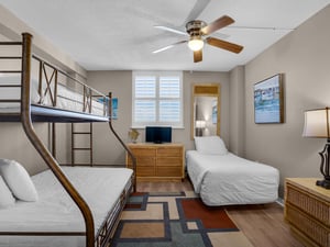 Bedroom 3 with twin over double bunk and additional twin bed