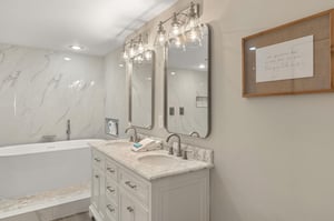 Step into your spalike bathroom with marble counters and a luxurious soaking tub.