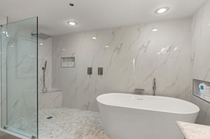 Slip into your own spa like bathroom featuring a luxurious soaking tub and rainfall shower.