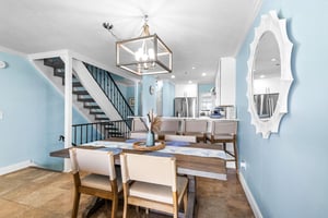 Savor memorable meals under elegant pendant lighting and open kitchen views.
