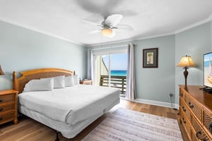 Bedroom 1 with King bed and access to a private Gulf Front Balcony