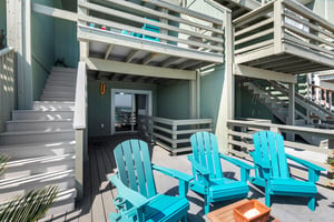 Relax in bright turquoise Adirondack chairs on one of the private decks
