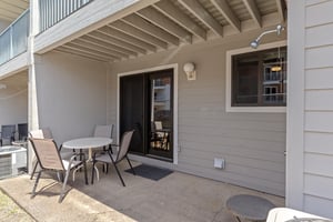 Back Patio located off of the kitchen featuring outdoor shower and furniture for dining al fresco