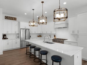 Modern open kitchen offering plenty of space for preparing meals and gathering. Located on 2nd floor living area.