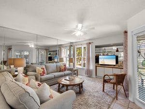 Sink into plush sofas in your bright, airy living room where tropical breezes flow through large windows.