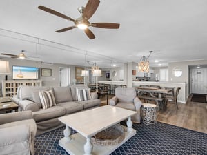 Unwind in this spacious, openconcept living area where coastal elegance meets comfort.