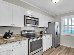 Natural light and modern touches make cooking a pleasure in this kitchen.