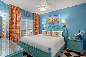 Sink into crisp white linens in this cheerful coastal Bedroom 1