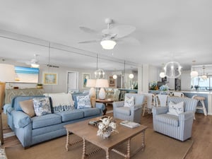 Relax in your bright coastal living space, where soft blues, nautical accents, and elegant decor invite you to unwind in beachy comfort. Lightfilled and open, its your perfect getaway haven.