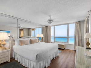 Your serene primary bedroom features crisp linens, coastal décor, and a private gulf panorama that invites peaceful mornings and restful nights.