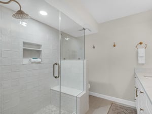 Refresh after a day of adventure in your spacious walkin shower, crisp white subway tile, and a builtin bench for ultimate comfort.