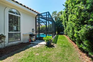 The Cove features a screenedin pool, lush tropical landscaping and a wellmaintained lawn