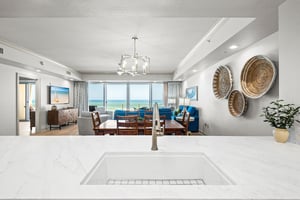 This bright, open living space invites you to unwind with stunning views stretching across the horizon from your balcony.