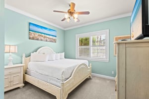 Unwind in this serene bedroom with its soothing coastalinspired palette promises restful nights and relaxing mornings.