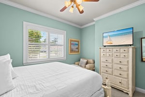 This peaceful retreat features calming coastal tones, a plush bed for restful nights, and beachinspired touches.