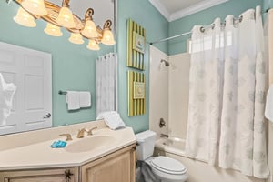 Sink into the bathroom where spalike finishes and soothing aqua tones create a relaxing escape after a day of adventure.