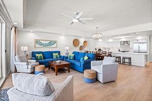 Settle into this openconcept living space, where thoughtful coastal decor and modern comforts blend seamlessly with the kitchen for easy vacation living.