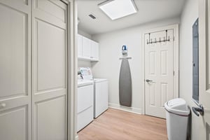 Laundry room with a fullsize washer and dryer makes packing light and staying fresh effortless during your stay.