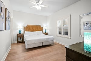 Sink into the comfort of the coastalinspired bedroom, where crisp linens and warm wood tones create a peaceful retreat.