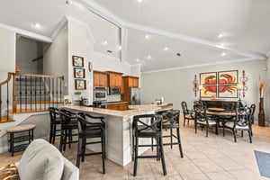 This openconcept kitchen and dining area are bright, spacious, and perfect for your group