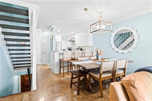 The openconcept living flows beautifully from the bright kitchen to elegant dining space.