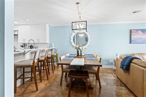 Gather around your spacious dining table for memorable meals, with an open kitchen perfect for easy entertaining.