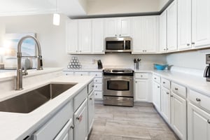 Step into your bright, fully equipped kitchen with stainless steel appliances, marble countertops, and all the tools you need to whip up delicious meals at home.