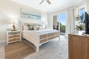 Your serene coastal retreat awaits with a plush bed, soothing oceaninspired decor, and private balcony access where you can unwind with natural light and refreshing breezes.