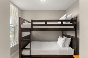Your kids will love this cozy bunk room with plenty of natural light, perfect for restful nights after funfilled days.