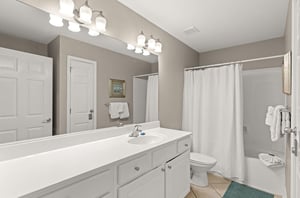 Freshen up in your guest bathroom, complete with and a soothing neutral palette that invites relaxation after a day of adventure.