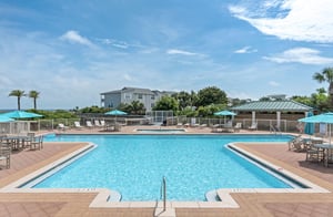 Dive into crystalclear waters surrounded by swaying palms and coastal breezes. Lounge poolside under bright turquoise umbrellas, soak up the sun, and let your worries drift away in this serene oasis.