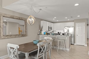 Picture yourself preparing meals in this bright, fullyequipped kitchen or enjoying coffee at the breakfast bar.