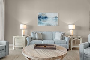 Unwind in your living room, where calming blues and soft grays create a peaceful retreat.