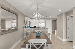 Your dining area flows effortlessly into a bright kitchen, perfect for gathering over meals and sharing vacation moments together.